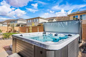 View of backyard featuring a hot tub