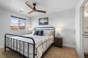 Bedroom with carpet and ceiling fan