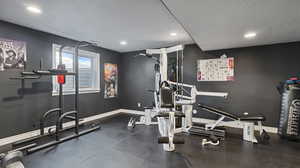 Workout room featuring a textured ceiling