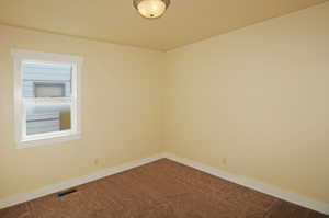 Spare room with carpet floors