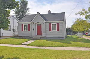 Bungalow with a front lawn