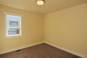 Spare room with carpet flooring