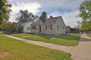 Bungalow with a front lawn