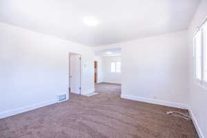 Spare room with plenty of natural light and carpet floors