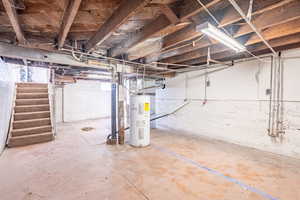 Basement featuring electric water heater