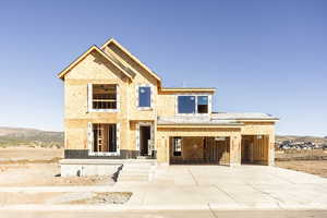 Unfinished property featuring a carport and a mountain view