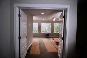 French doors invite you into the second-floor main bedroom which includes a vanity, toilet, shower, tub and walk-in closet.