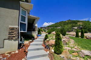 A professionally landscaped yard is an inviting entrance to this lovely home.