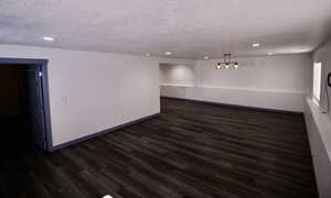 Spacious gaming room with tons of room for a big screen and other fun amenities.