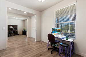 Inside entry way with office on one side and living room/formal dining area on the other side.