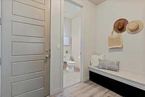 Mud room with garage access and half bath