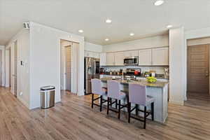 Kitchen with granite countertops and hallways to pantry