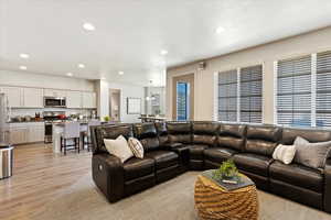 Family room with brand new carpet and wiring for surround sound speakers (not included)