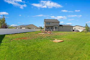 HUGE backyard with horseshoe pits, fire pit, and garden