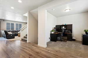 Inside entry way with office on one side and living room/formal dining area on the other side.