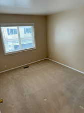 View of carpeted second  bedroom