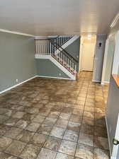 Front room of home featuring crown molding