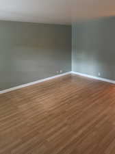 Master bedroom with light hardwood / wood-style flooring