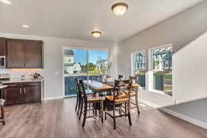 Dining space featuring plenty of natural light and light wood-style floors