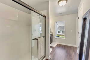 Master bathroom featuring an enclosed shower and vanity