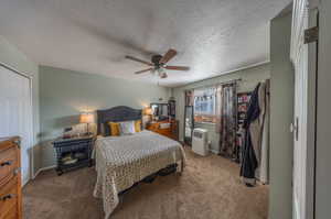 Primary bedroom with vaulted ceiling and en suite bathroom