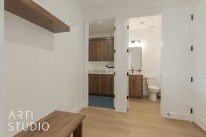 Bathroom featuring toilet, hardwood / wood-style flooring, and vanity