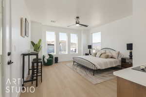 Bedroom with ceiling fan and light hardwood / wood-style floors