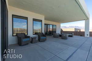 View of patio with a mountain view and an outdoor living space