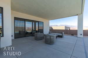 View of patio with an outdoor hangout area and a mountain view