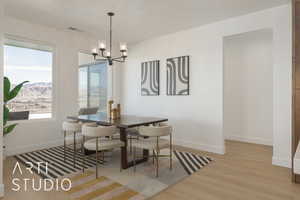 Dining area with a notable chandelier, light hardwood / wood-style flooring, and a mountain view