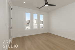 Empty room featuring ceiling fan and light hardwood / wood-style floors