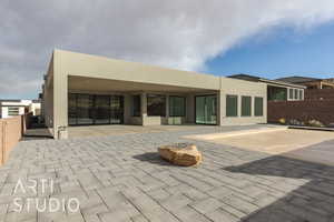 Back of house with a patio