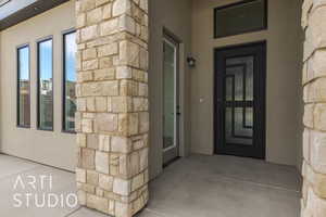 Entrance to property with a patio