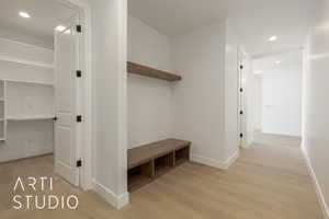 Corridor with light hardwood / wood-style floors