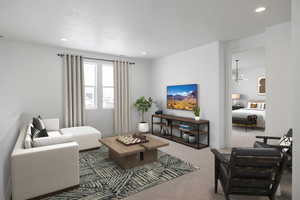 Living room with an inviting chandelier and carpet flooring