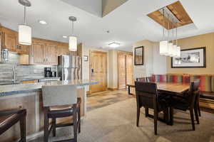 Dining space with light wood-type flooring