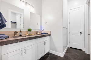 Double Bathroom in Bunk Room with 2 sinks 2 toilets & 2 full bathtubs.