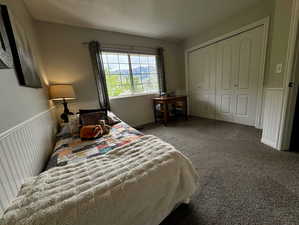 Bedroom with a closet and carpet flooring