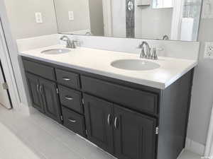 Master bathroom featuring tile patterned flooring and vanity