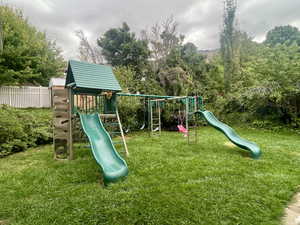 View of playground featuring a yard