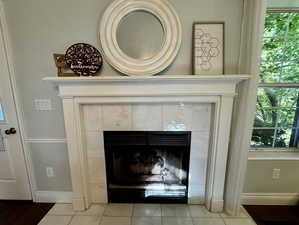 Details featuring a gas fireplace with marble tile.