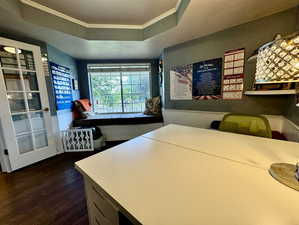 Office featuring a large, comfortable window seat, approximately the length of a twin bed.