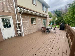 Deck (12x28) with a mountain view and a playground.