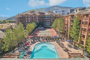 View of swimming pool featuring a mountain view and a patio area