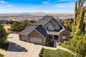 View of front of house with a garage and a mountain view