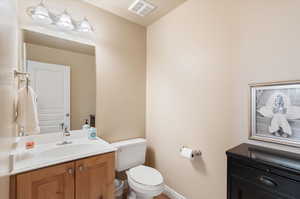 Bathroom with vanity and toilet