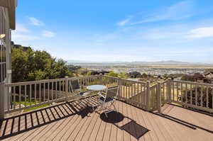 Wooden terrace featuring a mountain view