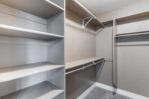 Walk in closet to primary bedroom