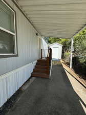 View of patio / terrace with a shed