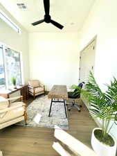 Office area featuring ceiling fan and wood-type flooring